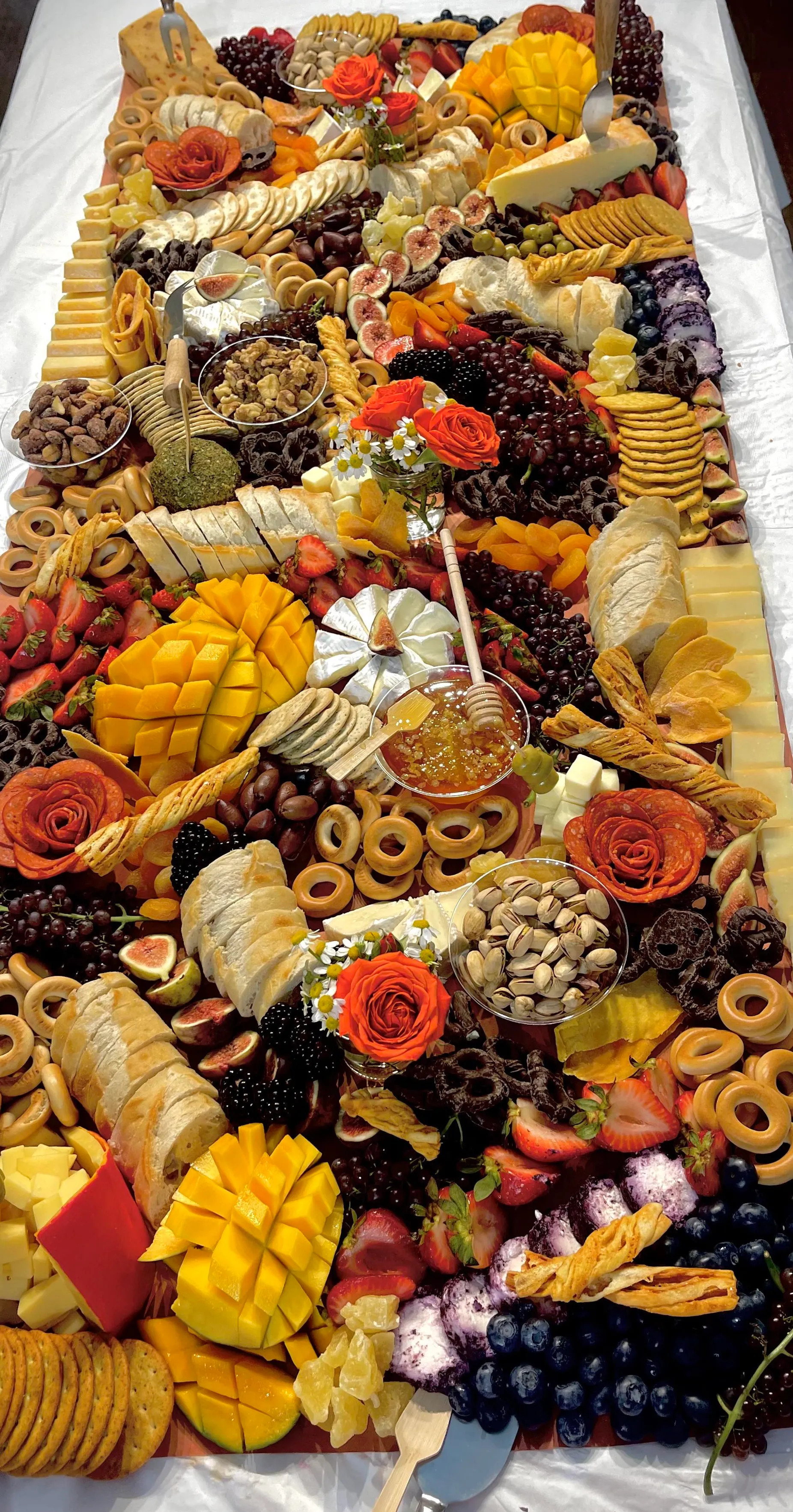 Stunning grazing table with variety of cheeses and accompaniments